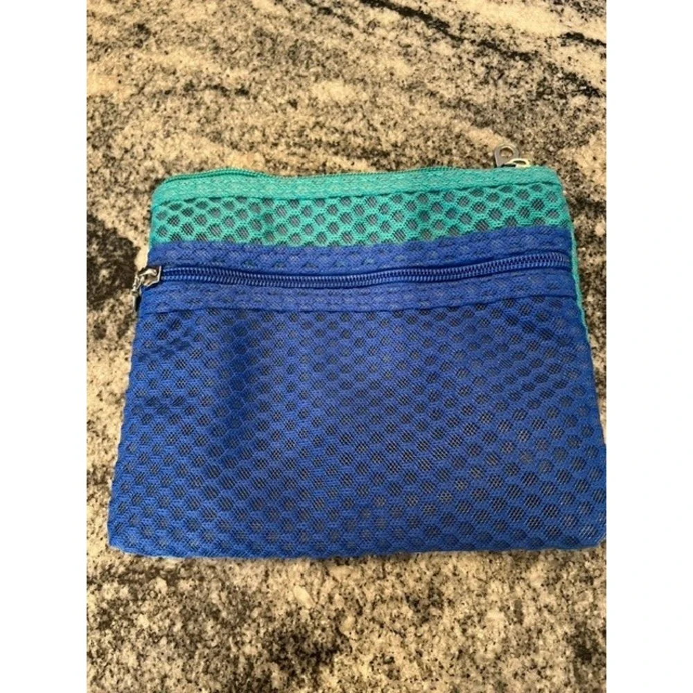 A New Day Green Zip Around Continental Wallet Wristlet‎ and a blue/teal pouch